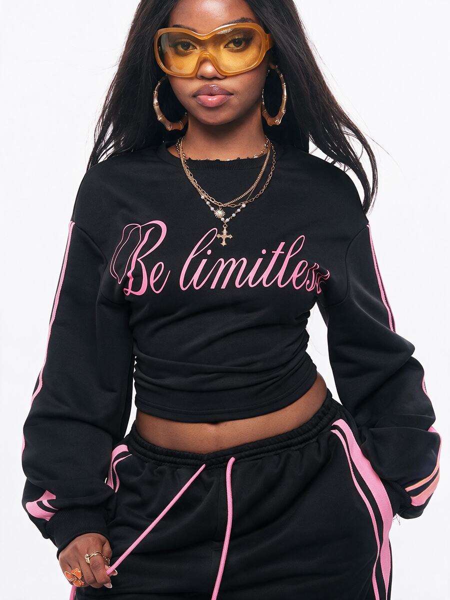 Women's casual black long sleeve knitted pullover sweatshirt featuring a round neck and cinched waist design.