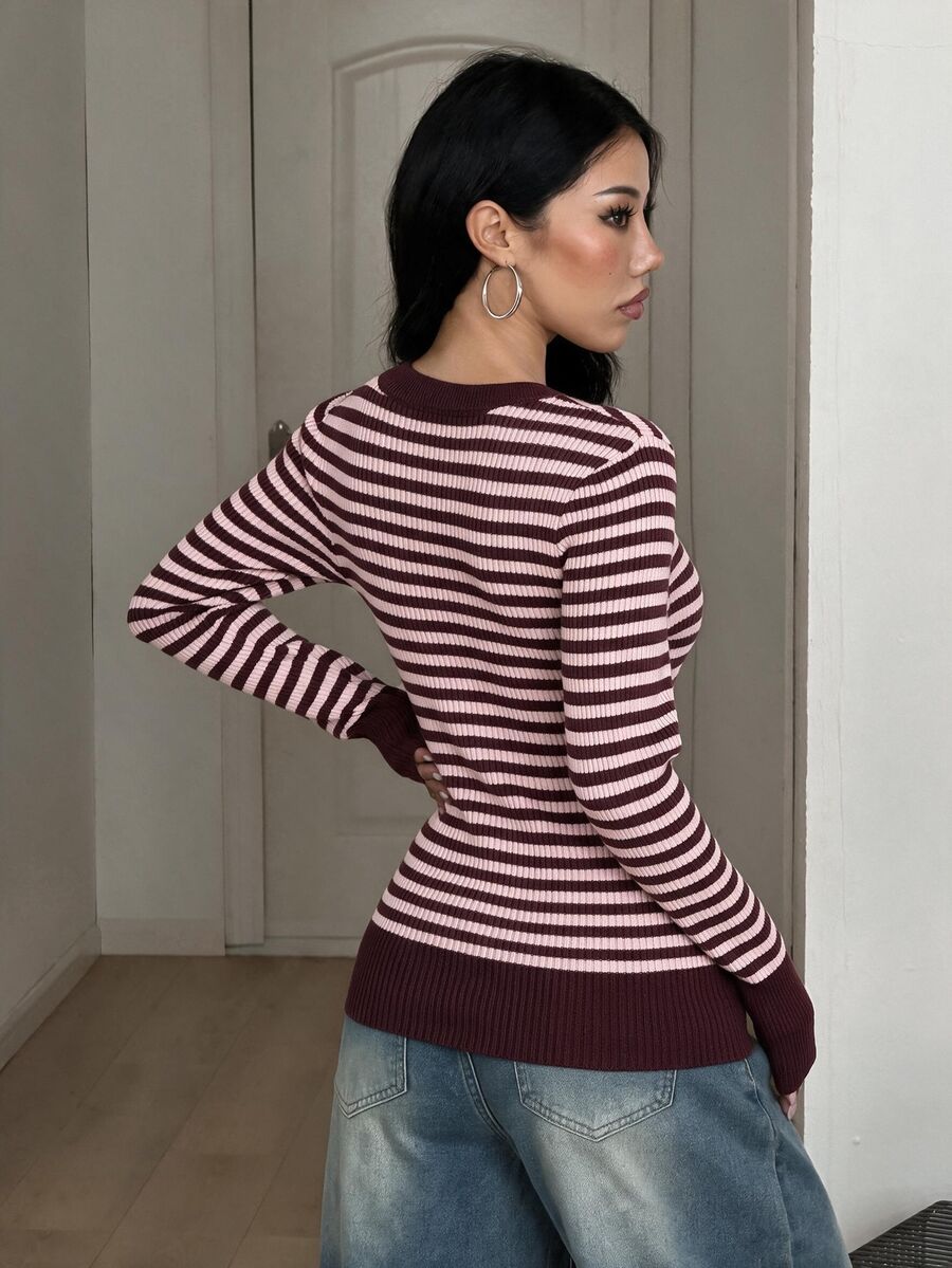 Women's slim fit cable-knit pullover sweater with deep V-neck and ribbed long sleeves