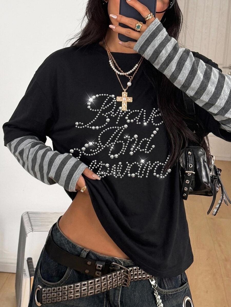 Women's casual 2-in-1 striped long sleeve graphic t-shirt featuring a round neckline, drop shoulders, rib-knit accents, and a loose fit.