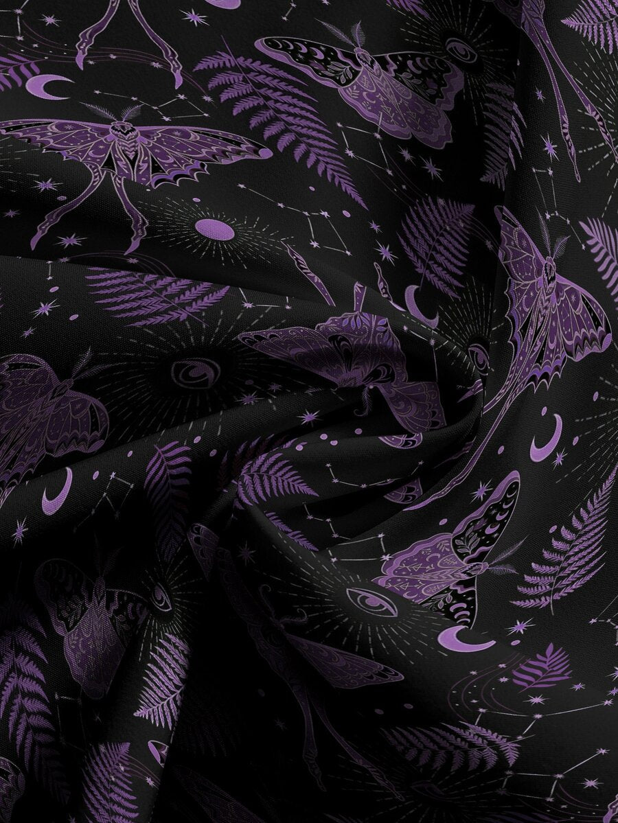 Women's plus size black gothic wide leg pants with split thigh detail and celestial moth, sun, and star pattern.