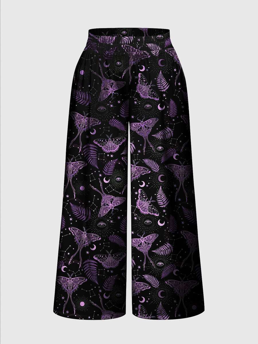 Women's plus size black gothic wide leg pants with split thigh detail and celestial moth, sun, and star pattern.