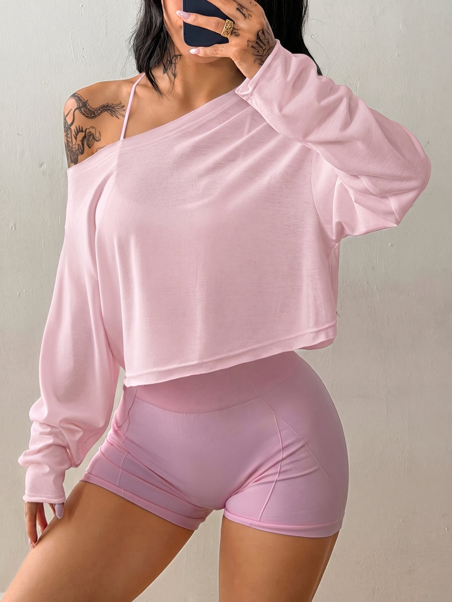 Women's white one shoulder rib-knit crop pullover top featuring an asymmetrical neckline, drop shoulder long sleeves, and a relaxed loose fit for yoga and athleisure wear.
