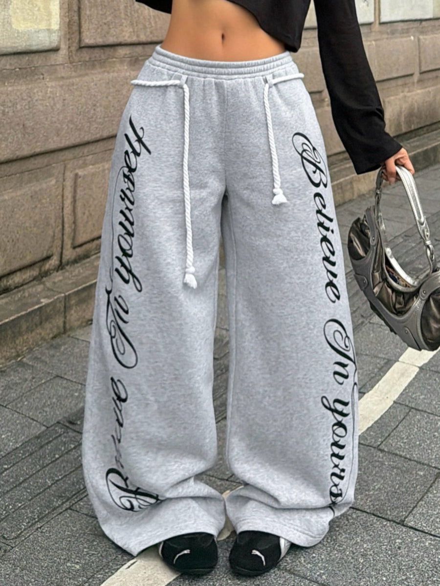 Women's wide leg trousers with a tree branch graphic pattern, loose fit, and mid-rise waist in woven fabric.