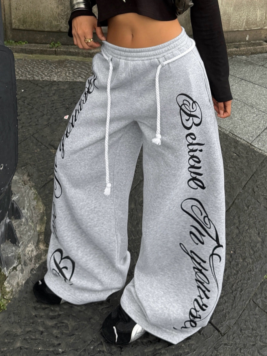 Women's wide leg trousers with a tree branch graphic pattern, loose fit, and mid-rise waist in woven fabric.