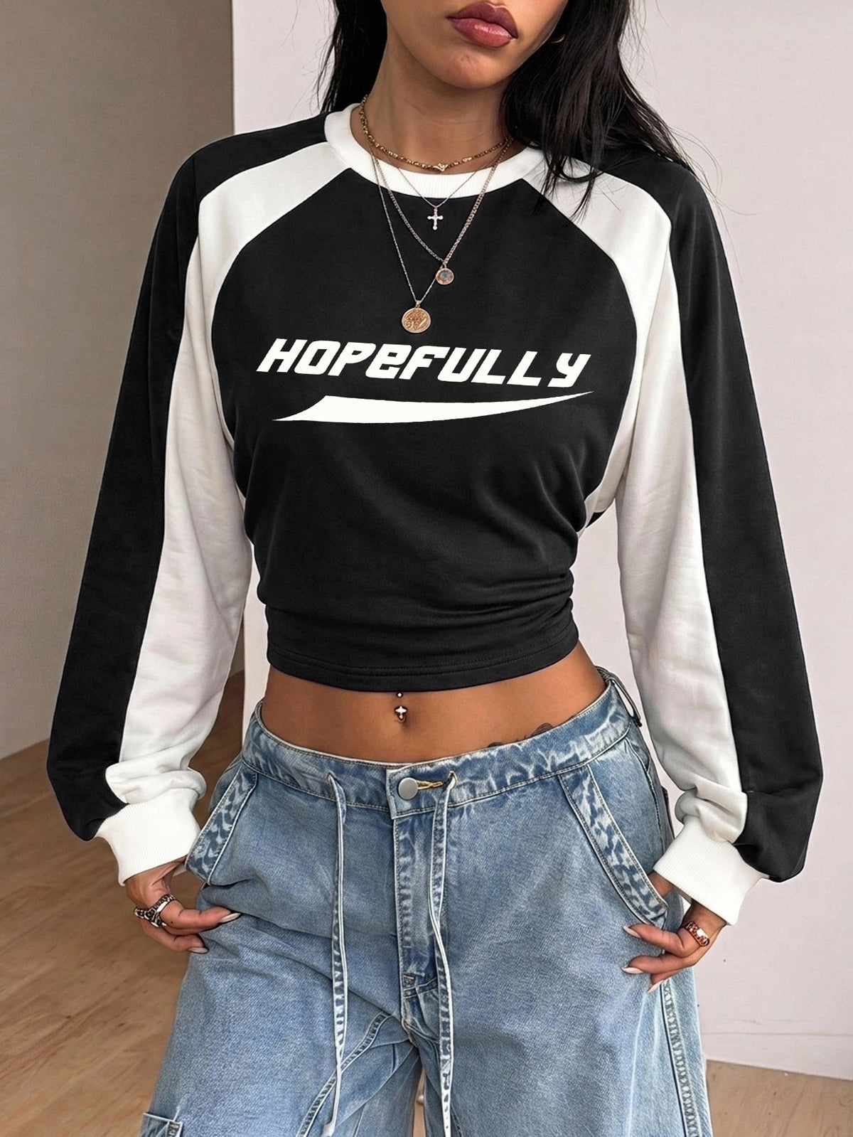 Women's brown waist-cinching sweatshirt featuring a round neck, drop shoulder long sleeves, and rib-knit cuffs.