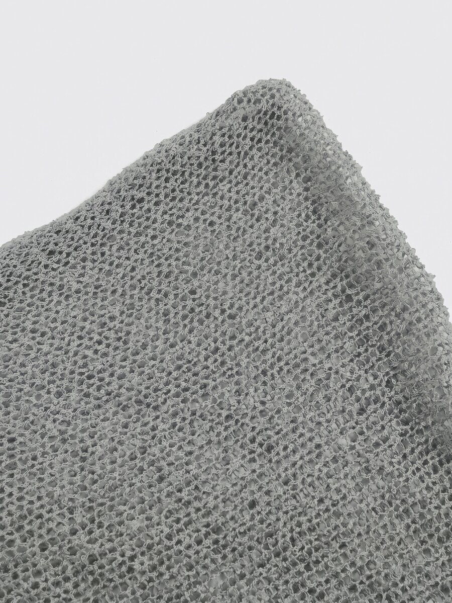 Women's casual hollow knit poncho top with boat neck, cloak sleeves, and asymmetrical hem