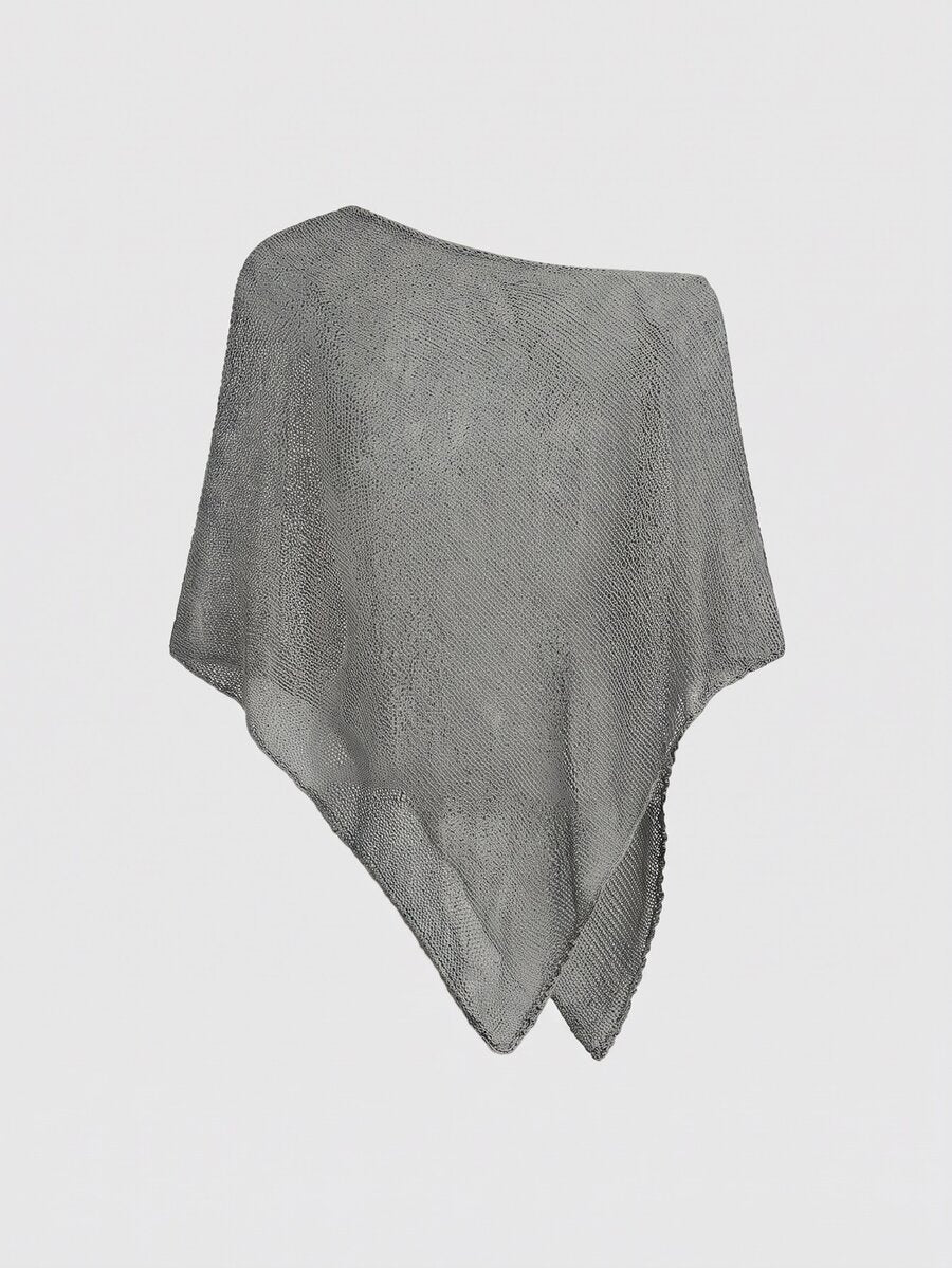 Women's casual hollow knit poncho top with boat neck, cloak sleeves, and asymmetrical hem