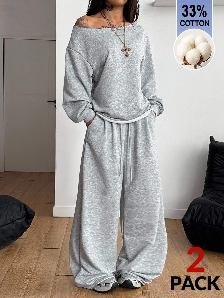 Women's two-piece casual lounge set featuring a loose drop-shoulder long sleeve sweatshirt and high-waist drawstring sweatpants with pockets.