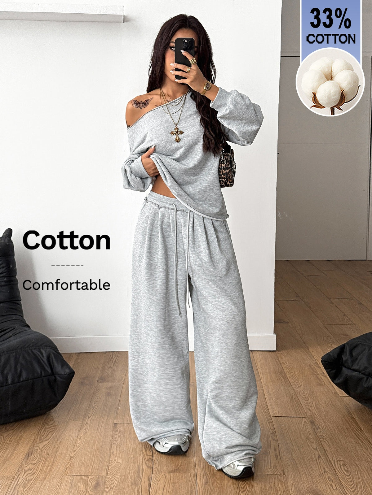 Women's two-piece casual lounge set featuring a loose drop-shoulder long sleeve sweatshirt and high-waist drawstring sweatpants with pockets.
