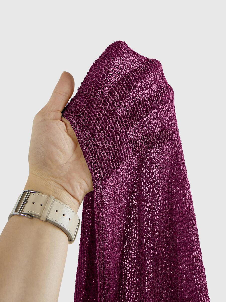 Women's casual hollow knit poncho top with boat neck, cloak sleeves, and asymmetrical hem