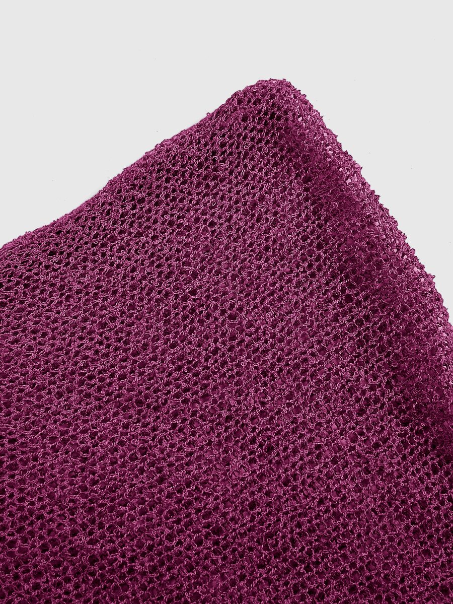 Women's casual hollow knit poncho top with boat neck, cloak sleeves, and asymmetrical hem