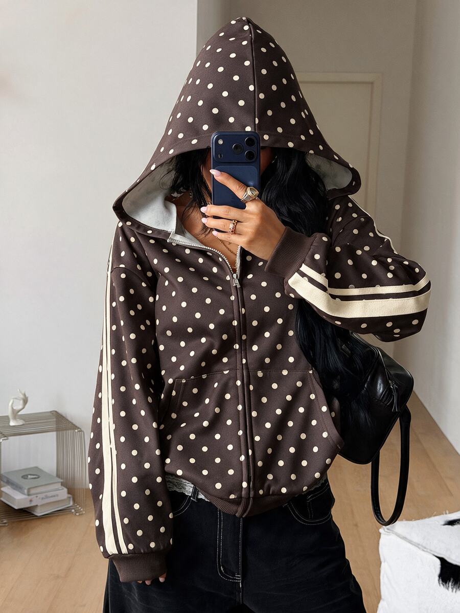 Women's army green camo zip up hoodie with drop shoulder sleeves, front pockets, and drawstring hood