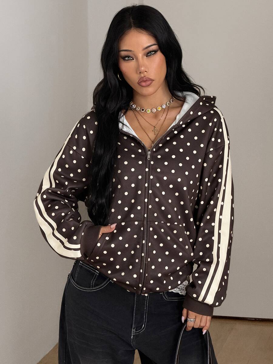 Women's army green camo zip up hoodie with drop shoulder sleeves, front pockets, and drawstring hood