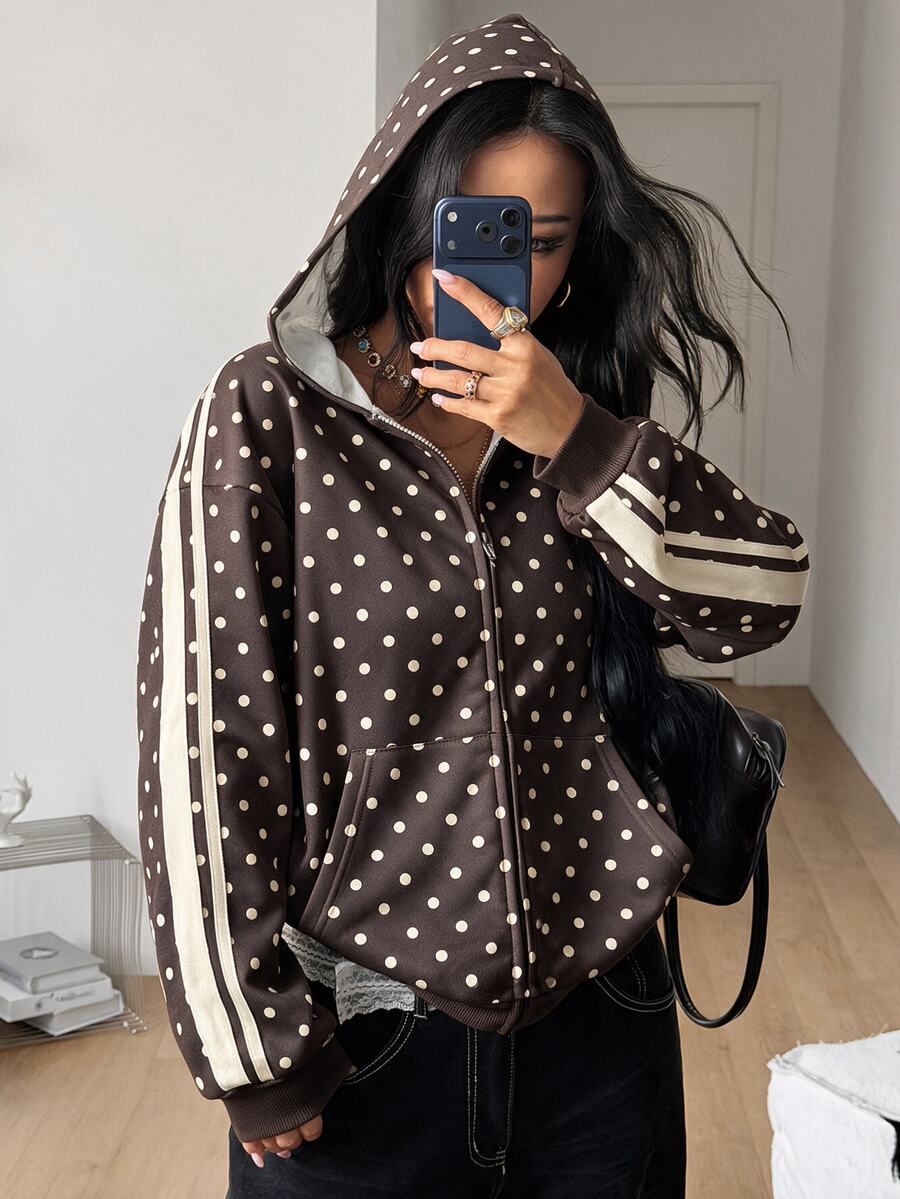 Women's army green camo zip up hoodie with drop shoulder sleeves, front pockets, and drawstring hood
