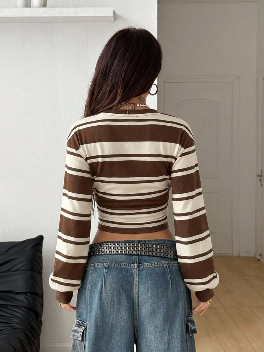 Women's striped pullover sweatshirt featuring drop shoulder long sleeves and a classic round neckline.