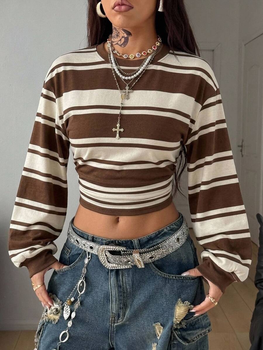 Women's striped pullover sweatshirt featuring drop shoulder long sleeves and a classic round neckline.