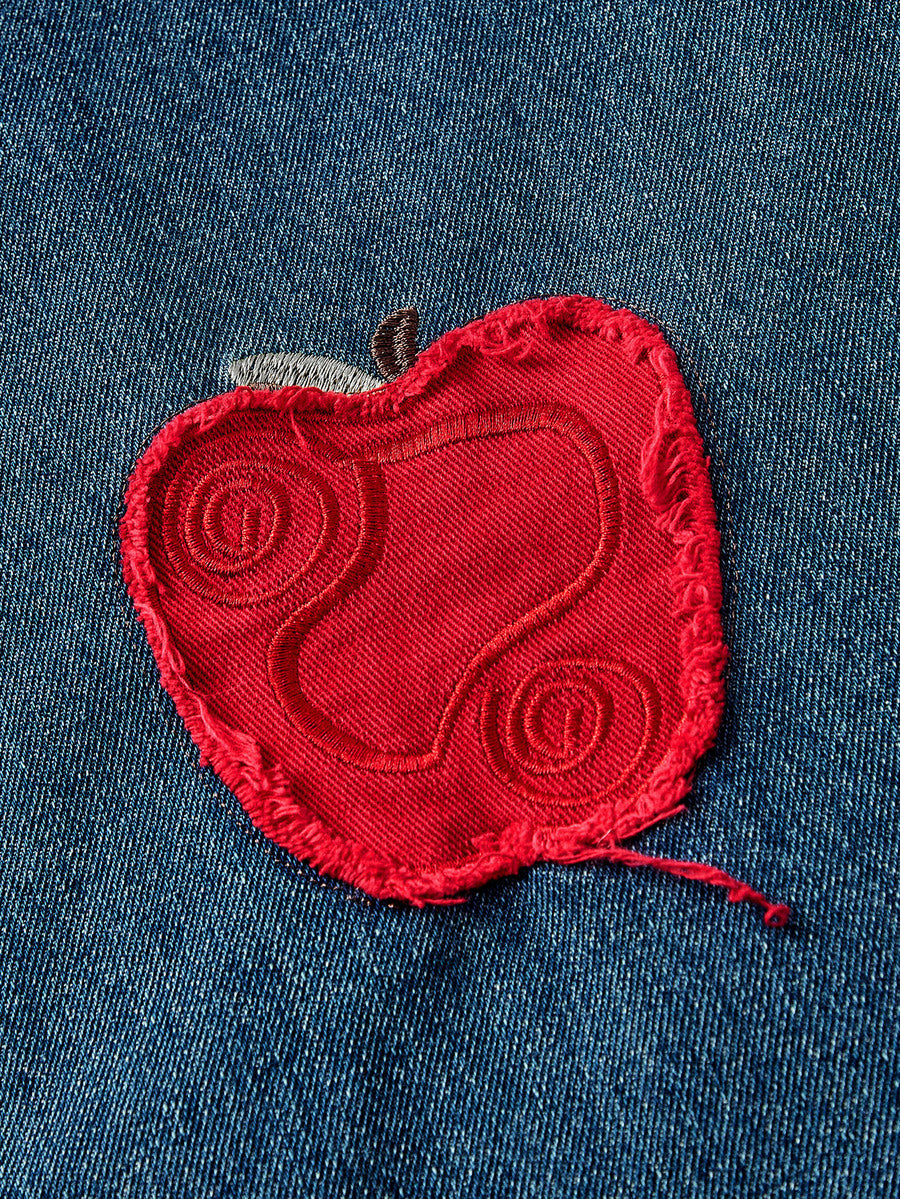 Women's loose baggy blue denim jeans featuring embroidered dragonfly and ladybug patch appliques, front pockets, and a straight-leg cut.