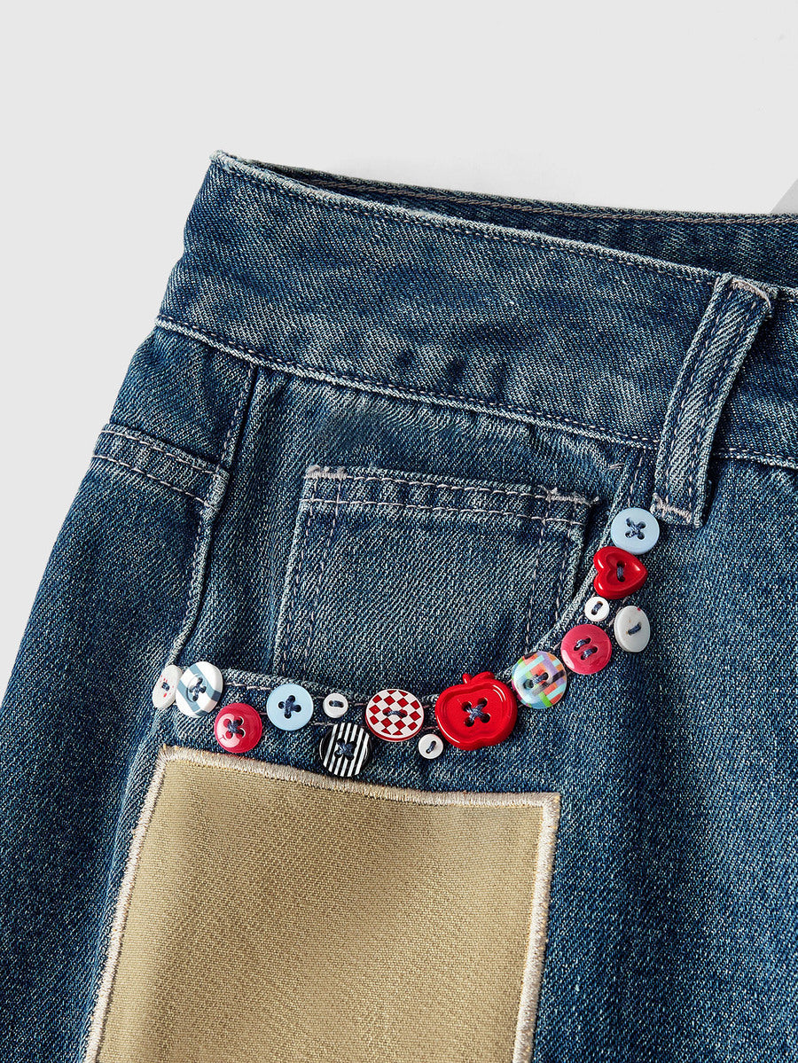 Women's loose baggy blue denim jeans featuring embroidered dragonfly and ladybug patch appliques, front pockets, and a straight-leg cut.