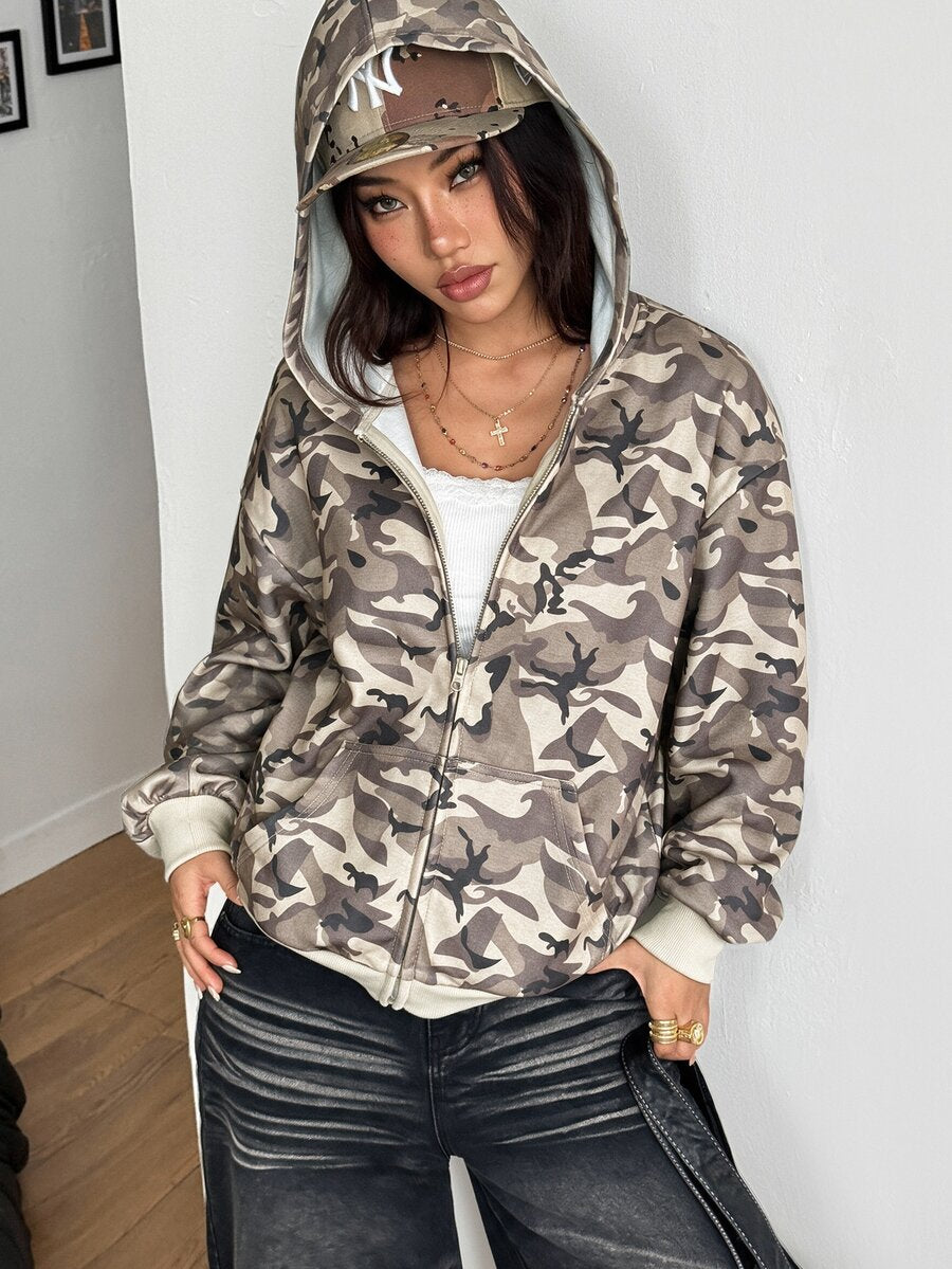 Women's oversized zip-up hooded sweatshirt featuring a striped pattern, drop shoulders, front pockets, and drawstring hood.
