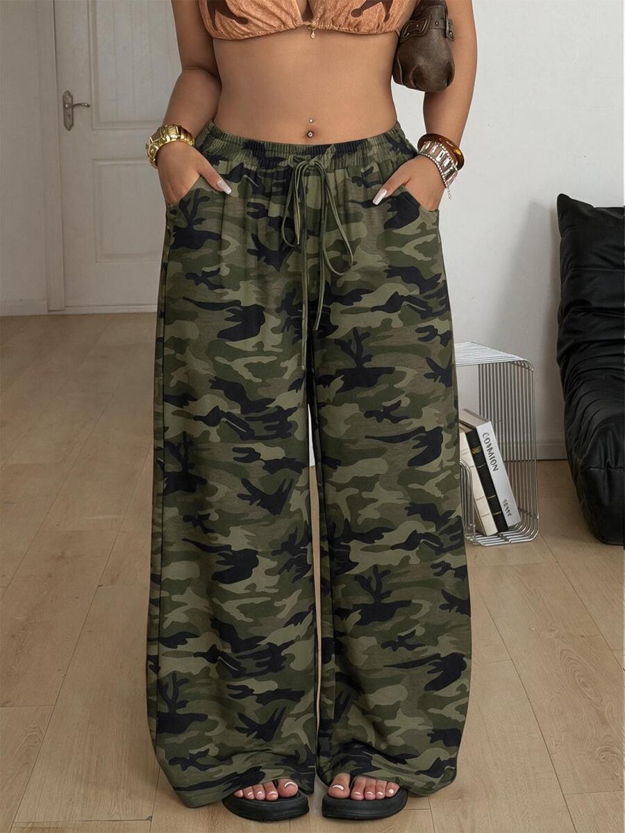 Women's plus size leopard print pants with an adjustable drawstring waist and loose straight leg fit.