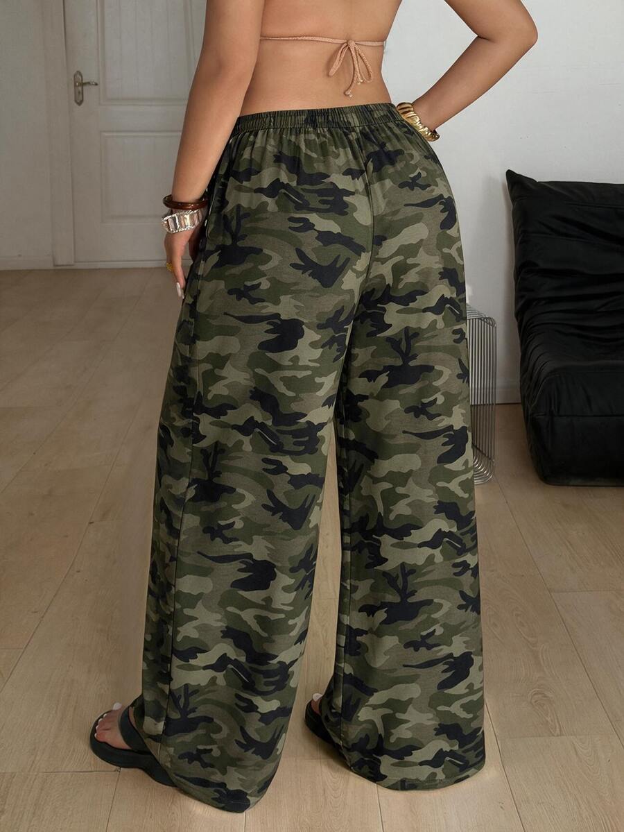 Women's plus size leopard print pants with an adjustable drawstring waist and loose straight leg fit.