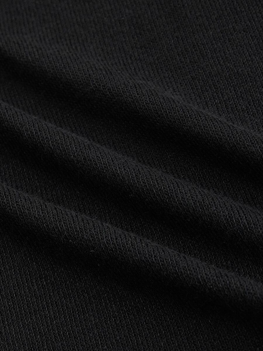 Black long sleeve open front micro crop top featuring contrast fluffy faux fur trim and knitted fabric.