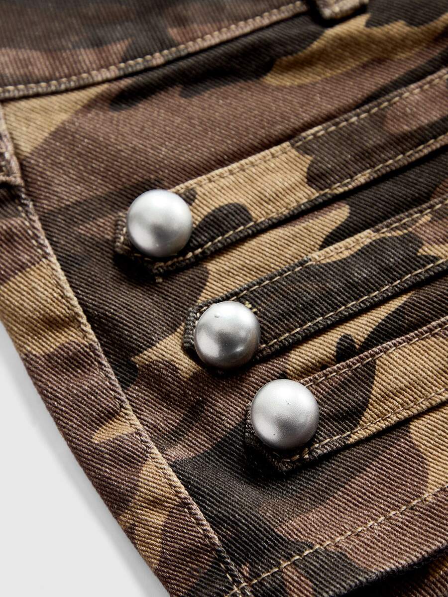 Front view of women's ultra low waist denim mini shorts with double metal button accents and zipper fly