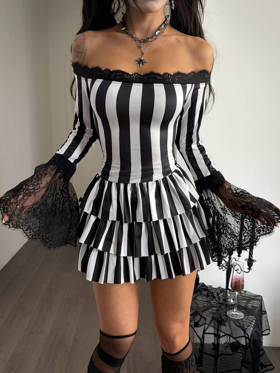 Black and white off-the-shoulder mini dress featuring flare sleeves, tiered ruffle asymmetrical hem, and lace patchwork details.