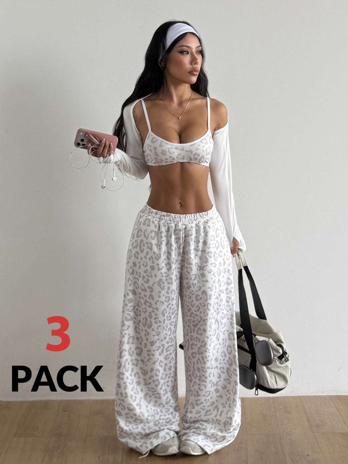 Women's 3-piece activewear set featuring a spaghetti strap crop tank top, matching pants, and a long sleeve bolero cover-up.