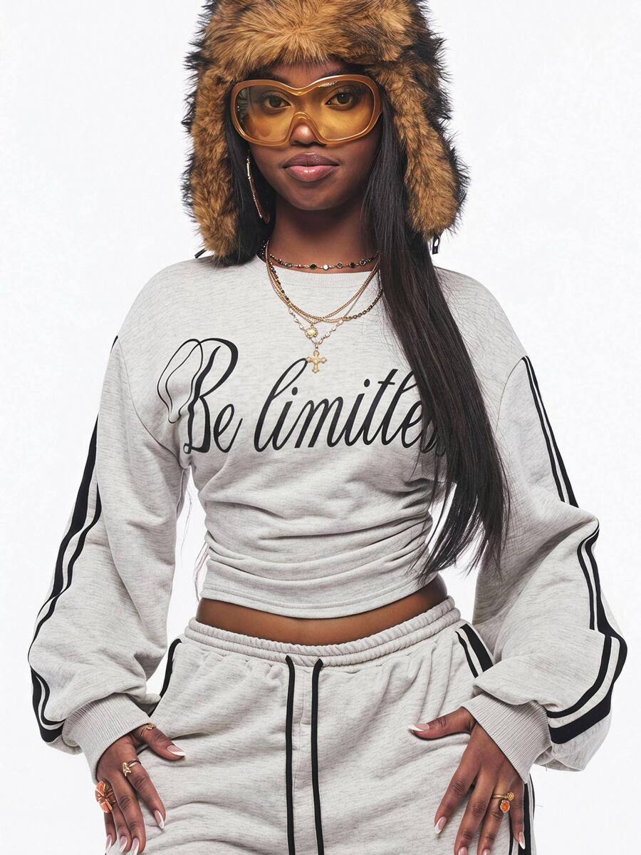 Women's casual black long sleeve knitted pullover sweatshirt featuring a round neck and cinched waist design.
