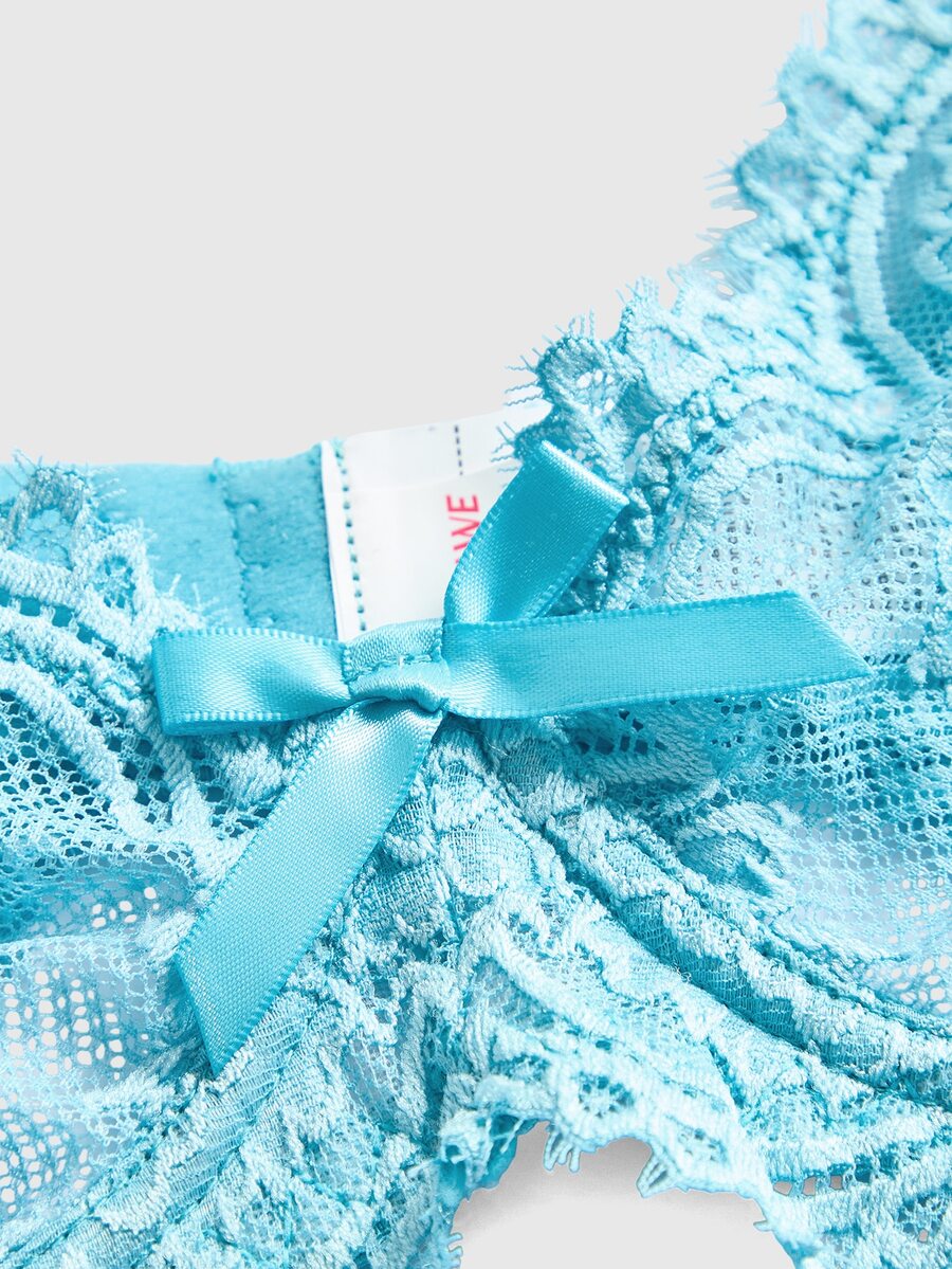 Sheer floral lace underwire triangle bra for women featuring adjustable straps and plunge cup design.