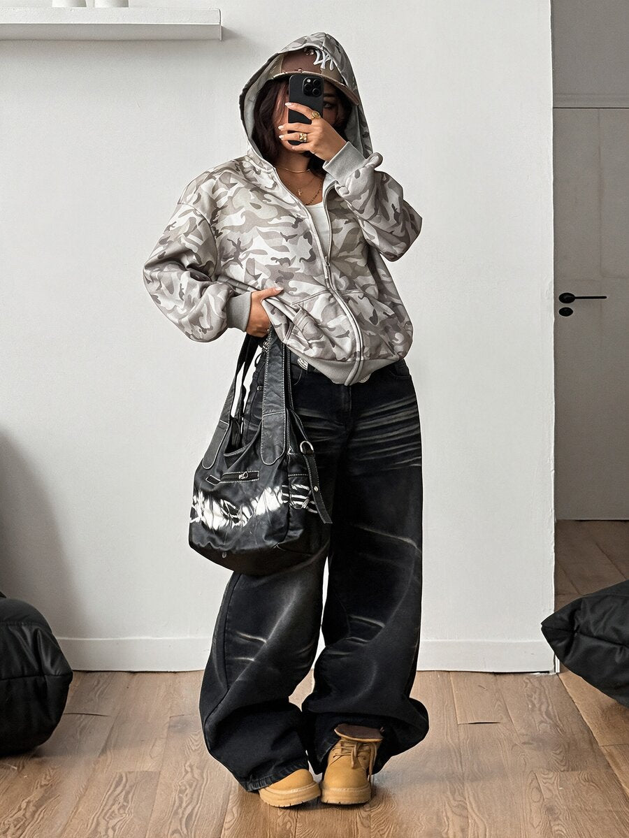 Women's oversized zip-up hooded sweatshirt featuring a striped pattern, drop shoulders, front pockets, and drawstring hood.