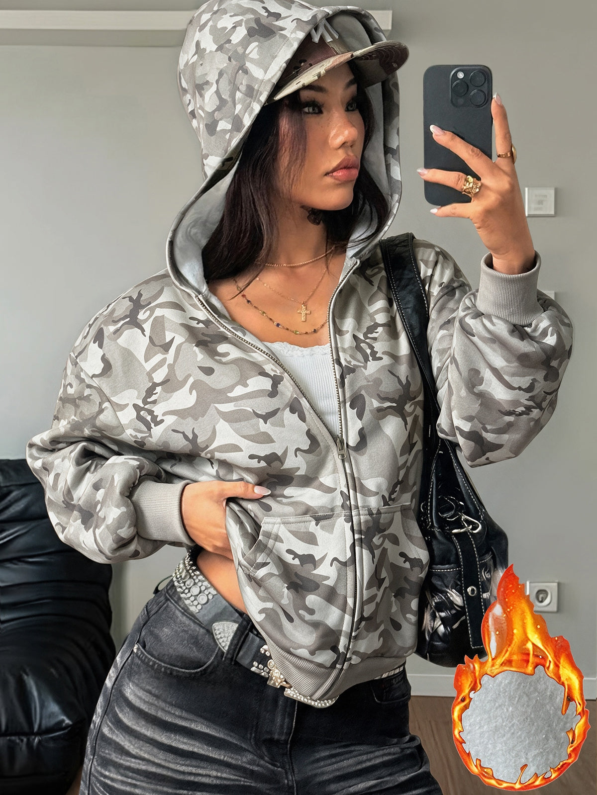 Women's oversized zip-up hooded sweatshirt featuring a striped pattern, drop shoulders, front pockets, and drawstring hood.