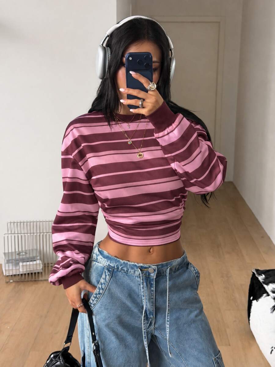 Women's striped pullover sweatshirt featuring drop shoulder long sleeves and a classic round neckline.