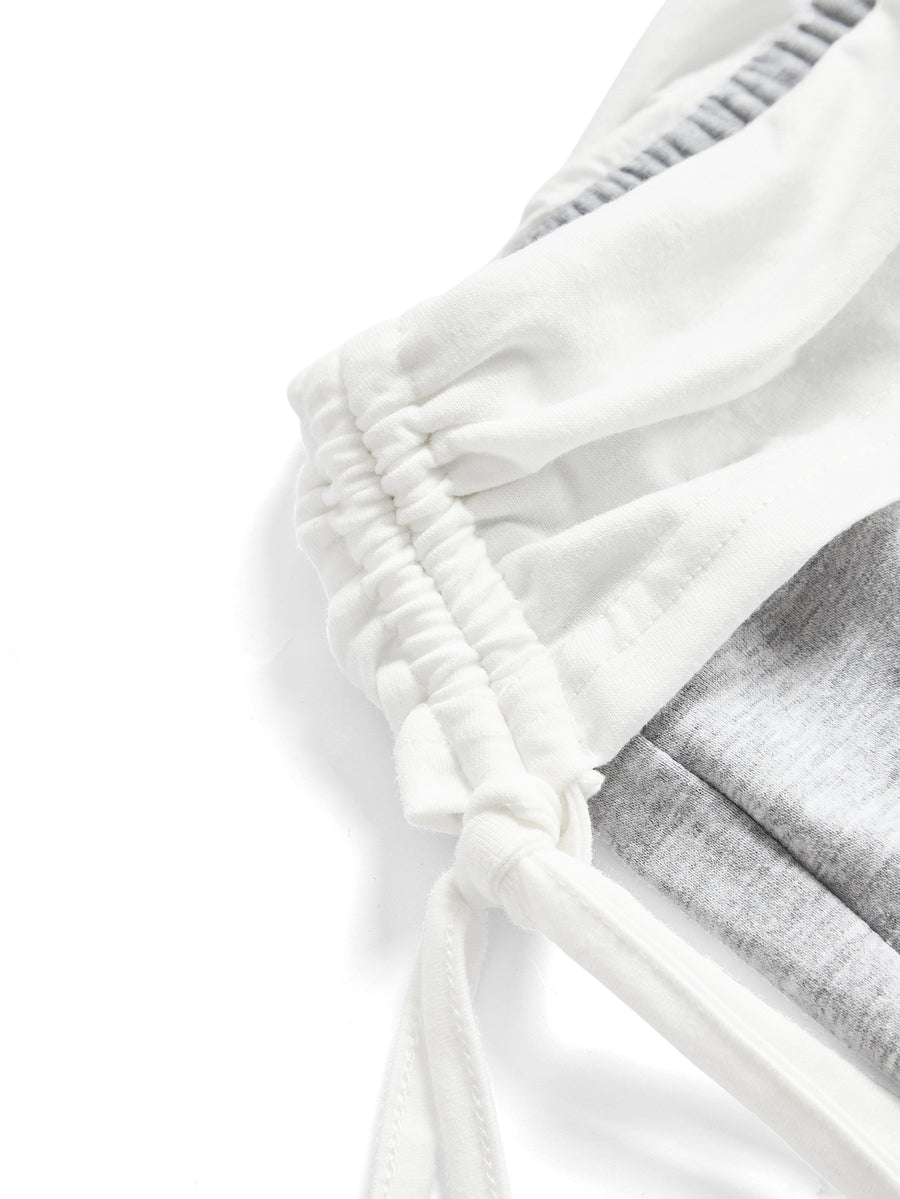 Women's low waist flare leg pants featuring an elastic drawstring waistband and ruched detail in knitted fabric.