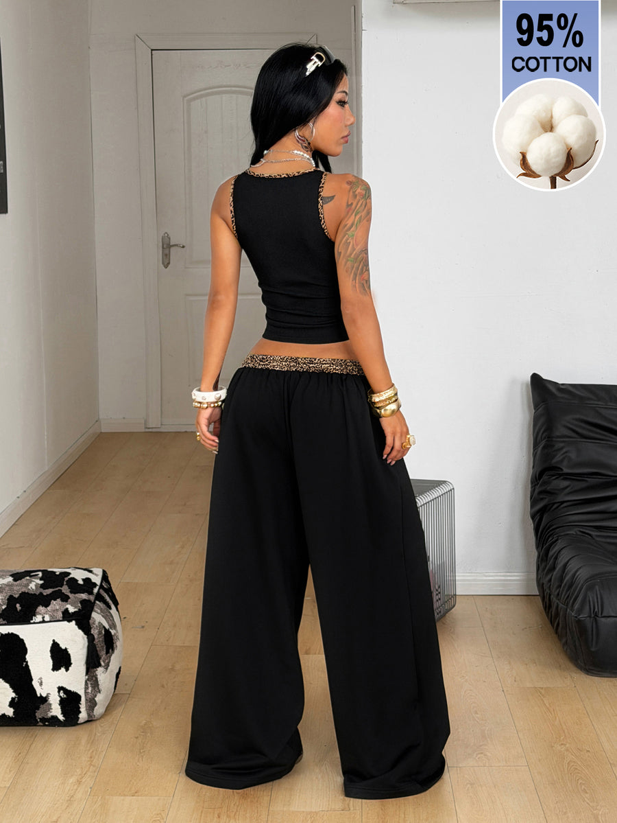 Women's two-piece casual outfit featuring a slim-fit camisole tank top with ruffle trim and button front paired with high-waisted wide leg pants.