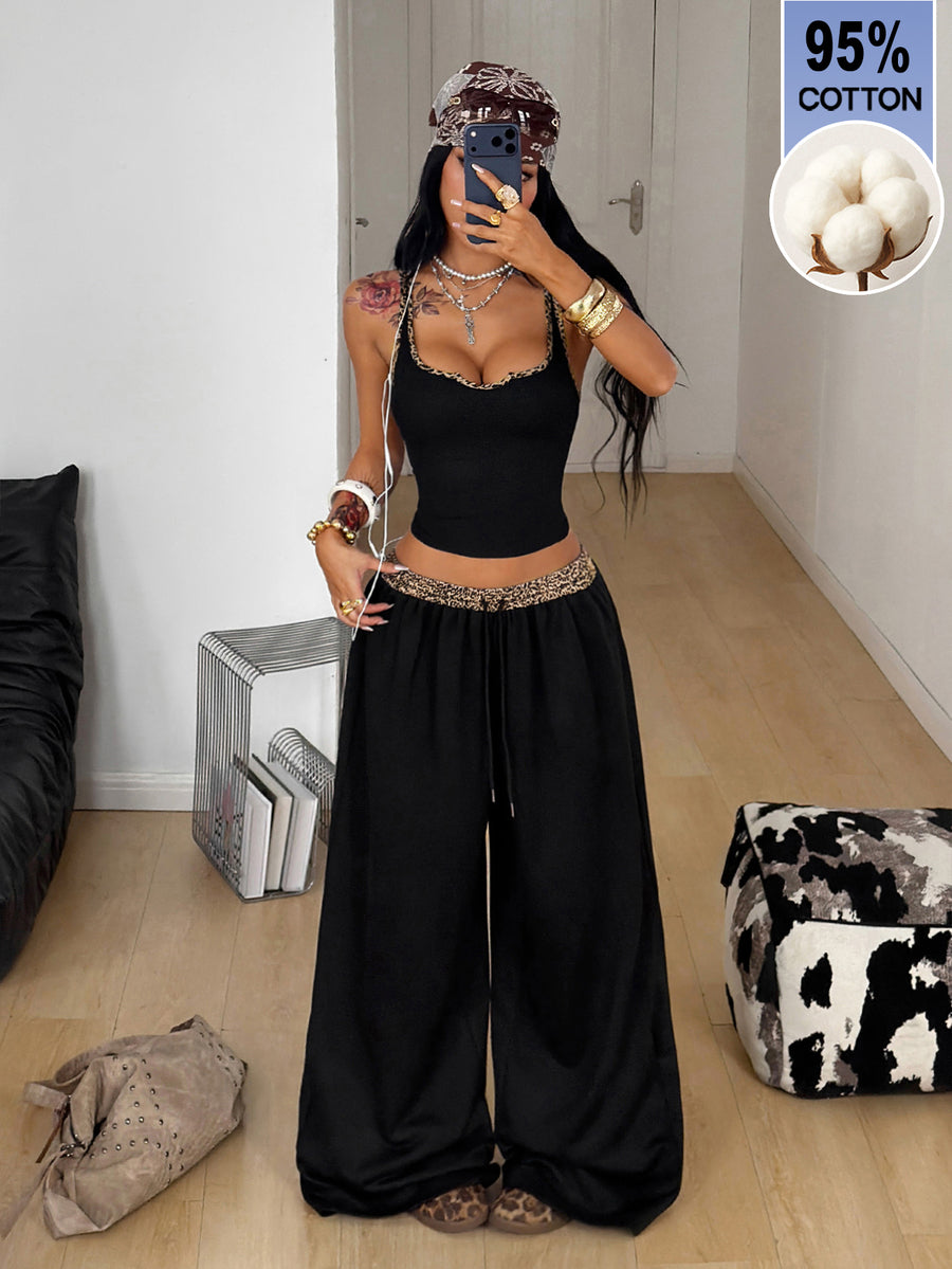 Women's two-piece casual outfit featuring a slim-fit camisole tank top with ruffle trim and button front paired with high-waisted wide leg pants.