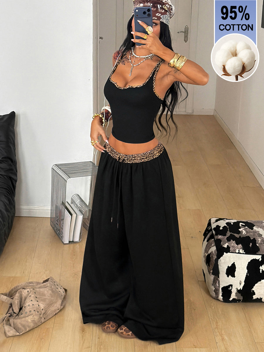 Women's two-piece casual outfit featuring a slim-fit camisole tank top with ruffle trim and button front paired with high-waisted wide leg pants.