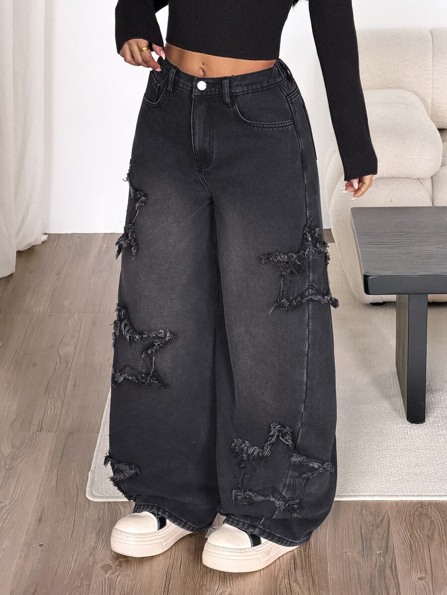 Front view of women's loose wide leg denim jeans featuring a mid waist, classic front pockets, and a zipper fly closure.