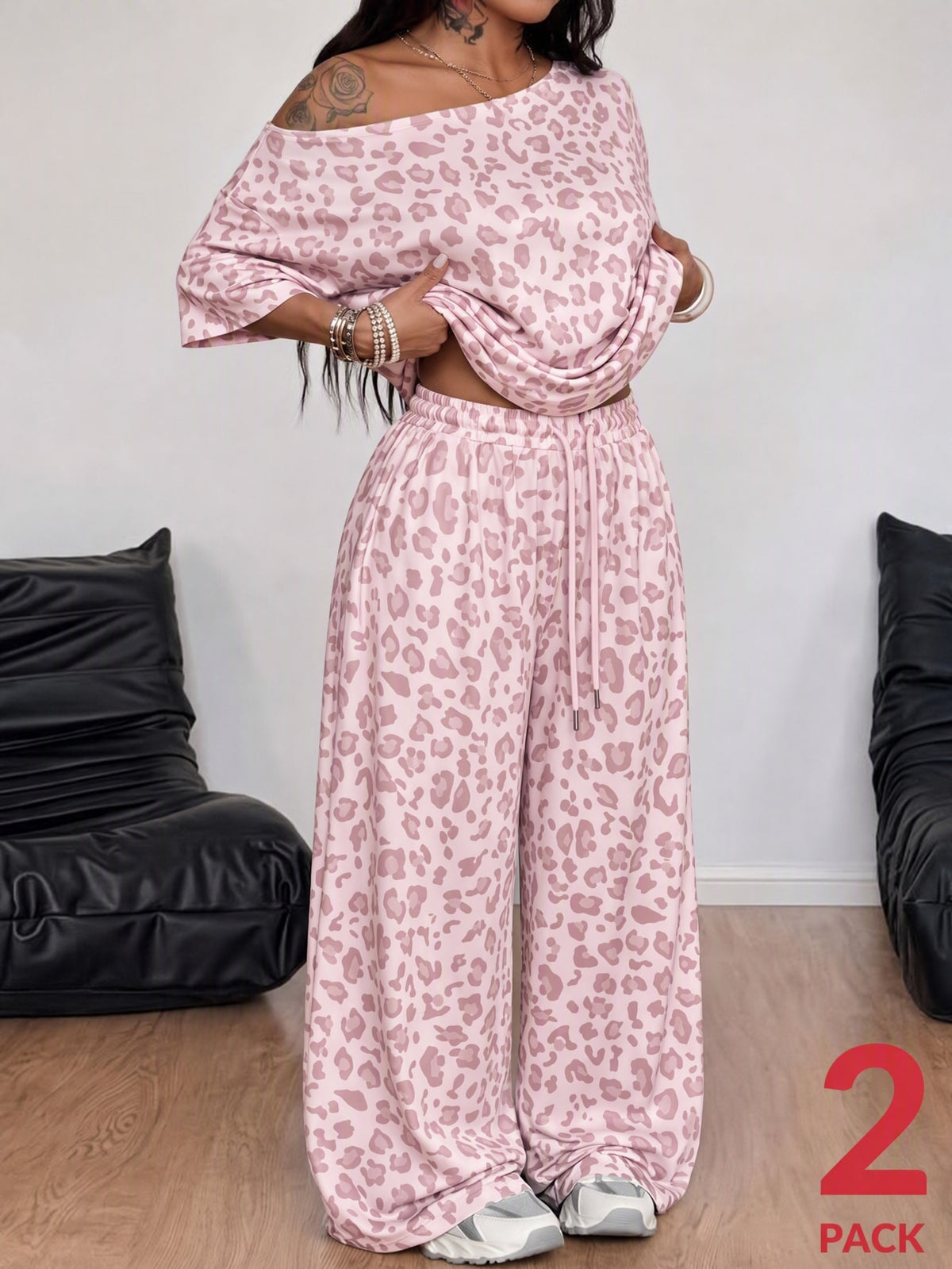 Women's two-piece lounge set featuring a loose drop shoulder asymmetrical neck short sleeve t-shirt and wide-leg knit pants with pockets.