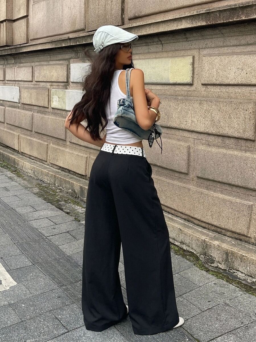 Women's casual straight leg striped woven pants featuring a low waist and zipper fly closure.