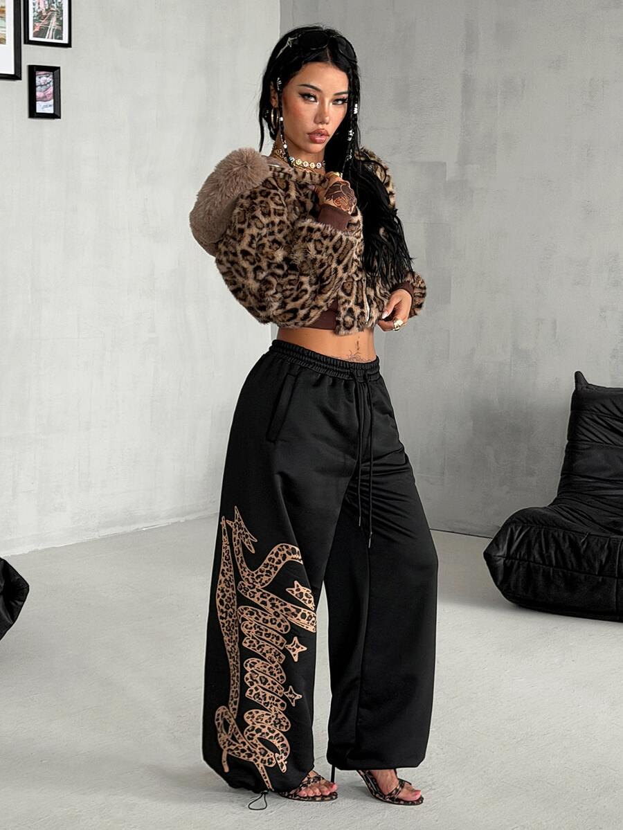 Women's loose fit wide leg graphic sweatpants in light grey with an elastic drawstring waistband