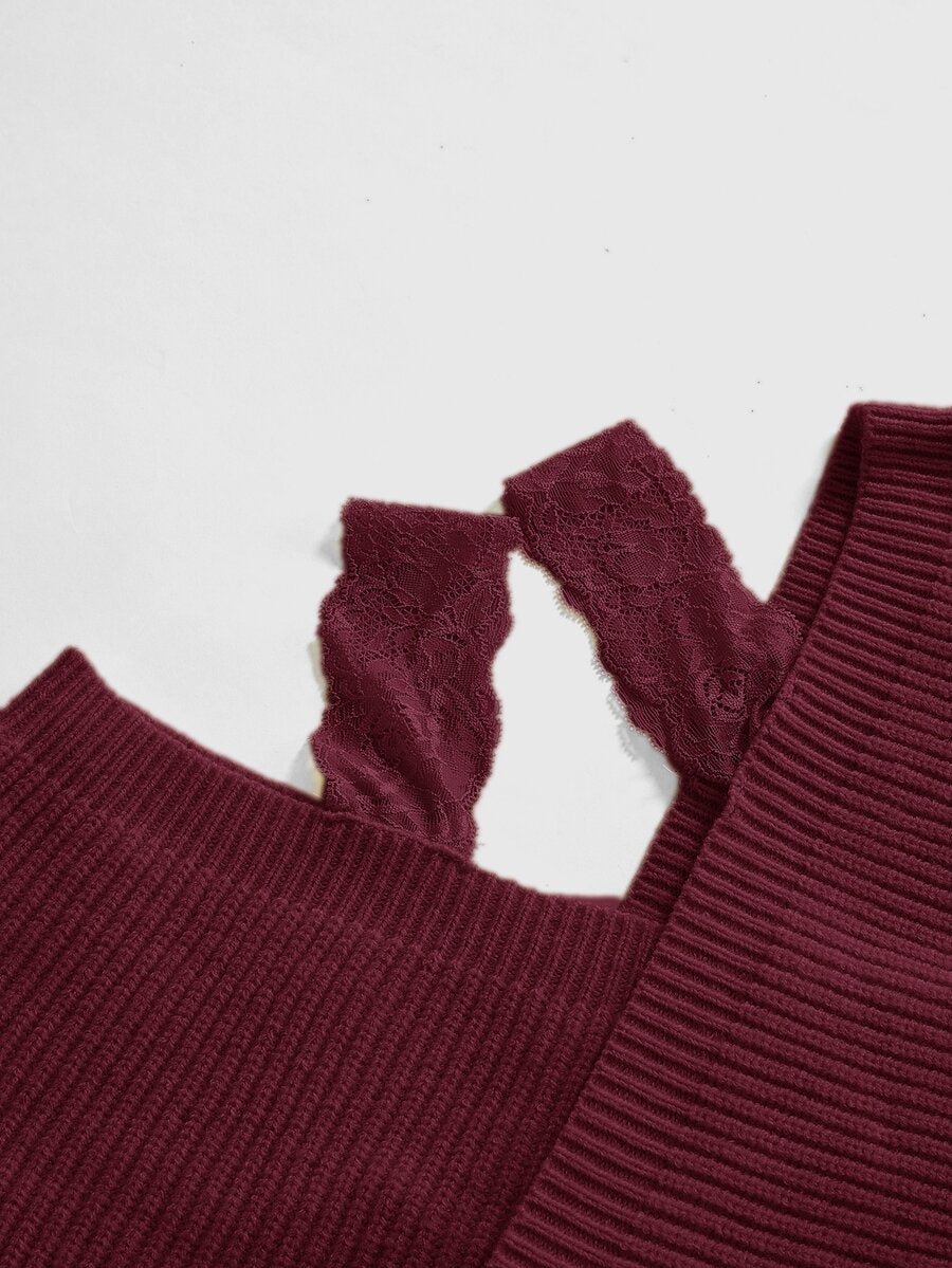 Women's two-piece rib-knit sweater set featuring a long-sleeve cold-shoulder crop top with strap details and matching wide-leg pants.