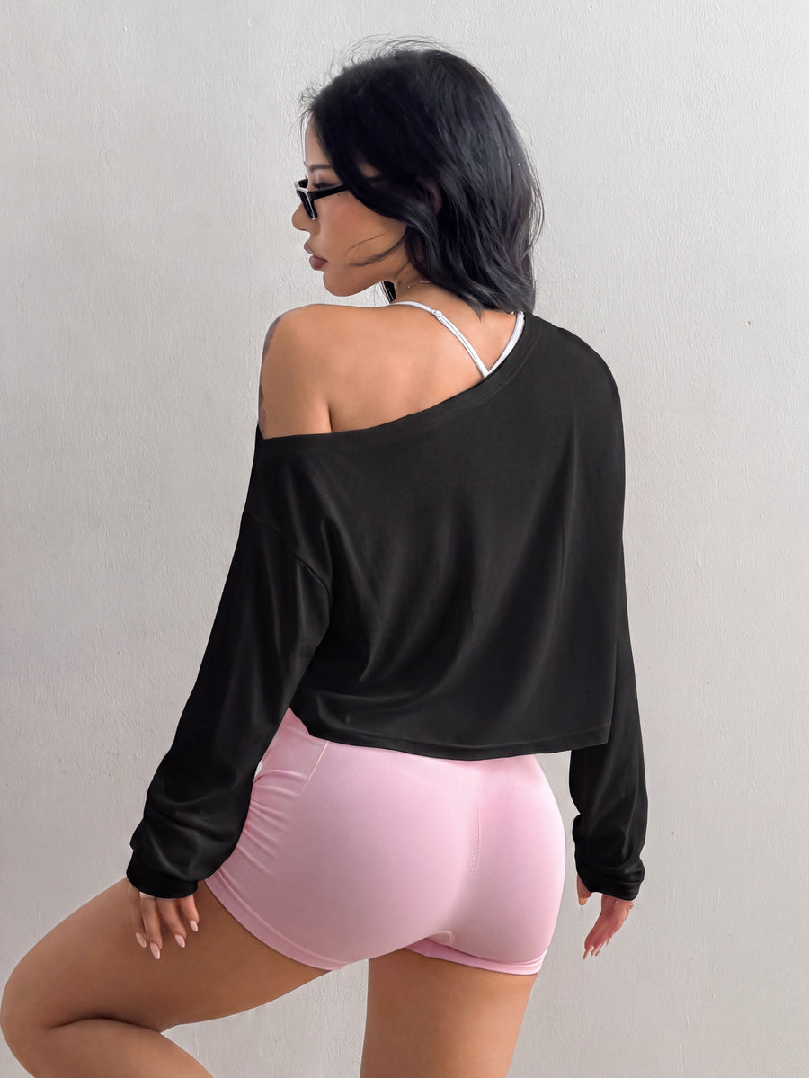 Women's white one shoulder rib-knit crop pullover top featuring an asymmetrical neckline, drop shoulder long sleeves, and a relaxed loose fit for yoga and athleisure wear.