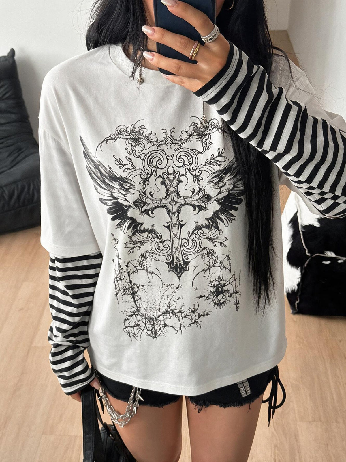 Women's casual graphic long sleeve t-shirt with a round neck, drop shoulder sleeves, and loose relaxed fit.