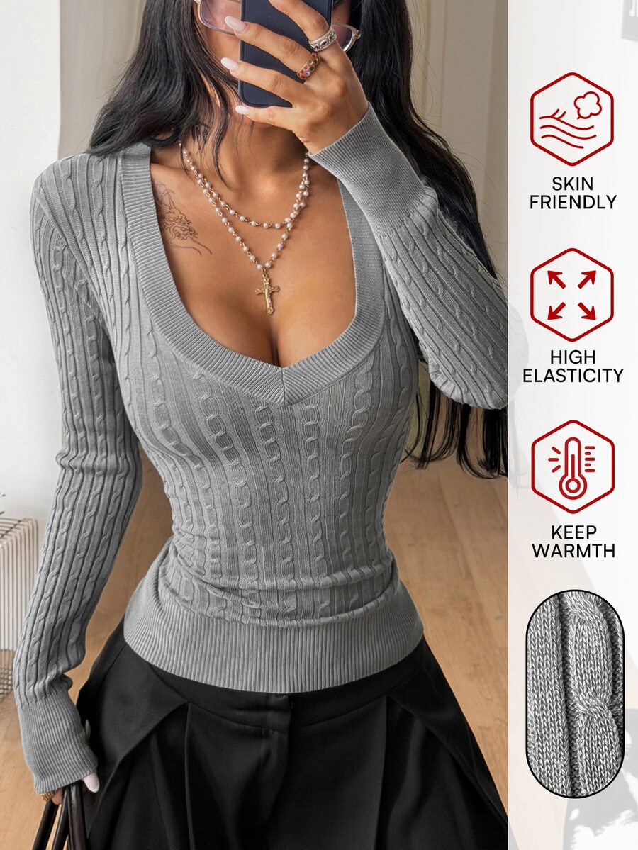 Women's slim fit cable-knit sweater with a V-neckline and long sleeves in solid green rib knit fabric.