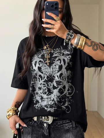 Unisex oversized grey graphic t-shirt featuring drop shoulder half sleeves, a round neckline, and a relaxed loose fit.