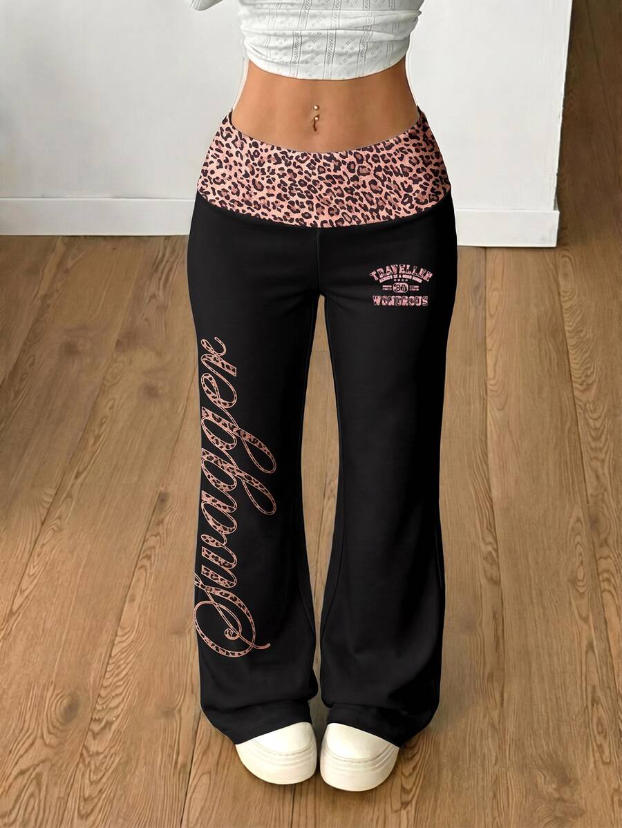 Women's black leopard print flare leg sweatpants with an elastic mid waist crafted from cotton knitted fabric.