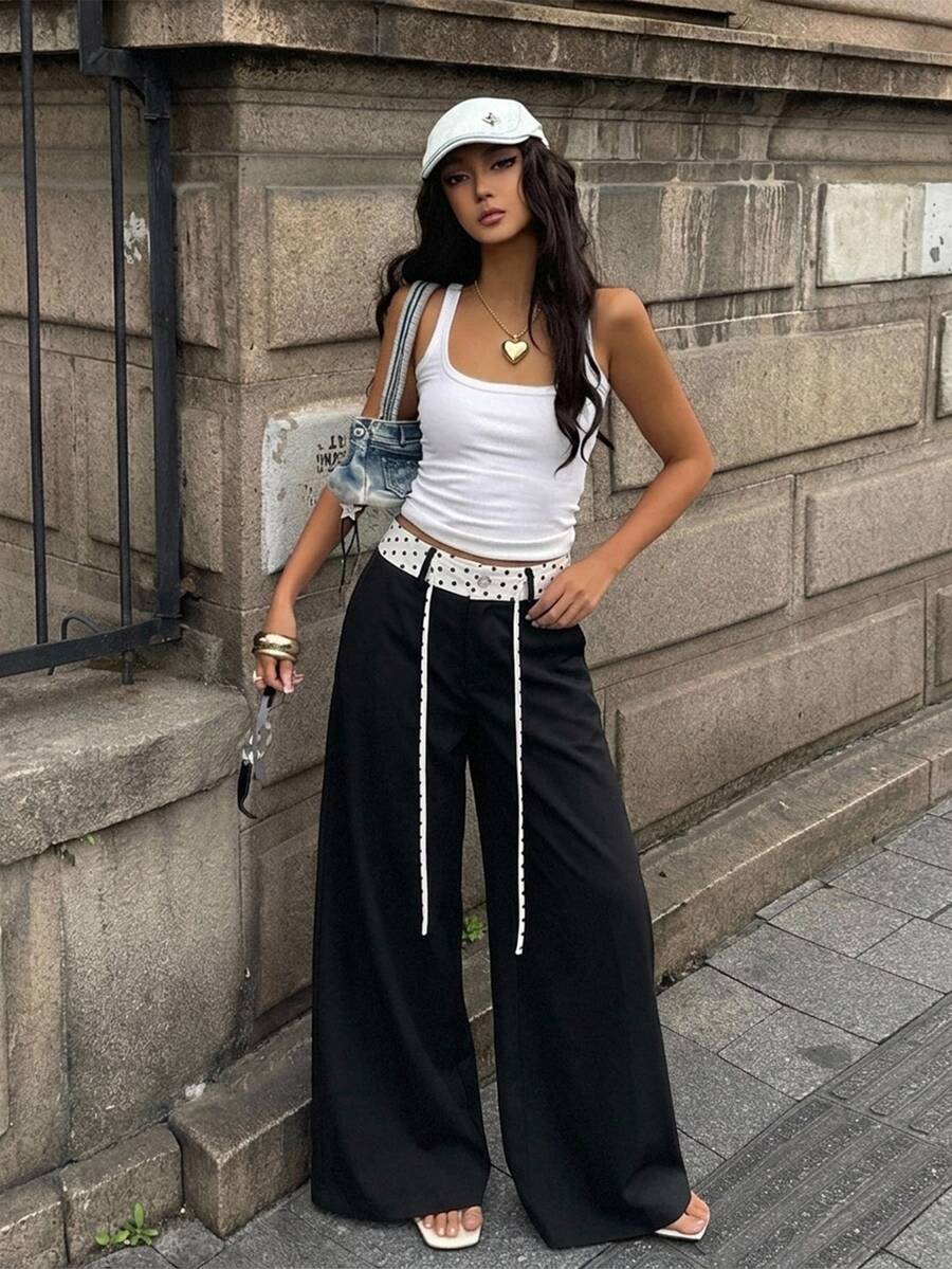 Women's casual straight leg striped woven pants featuring a low waist and zipper fly closure.