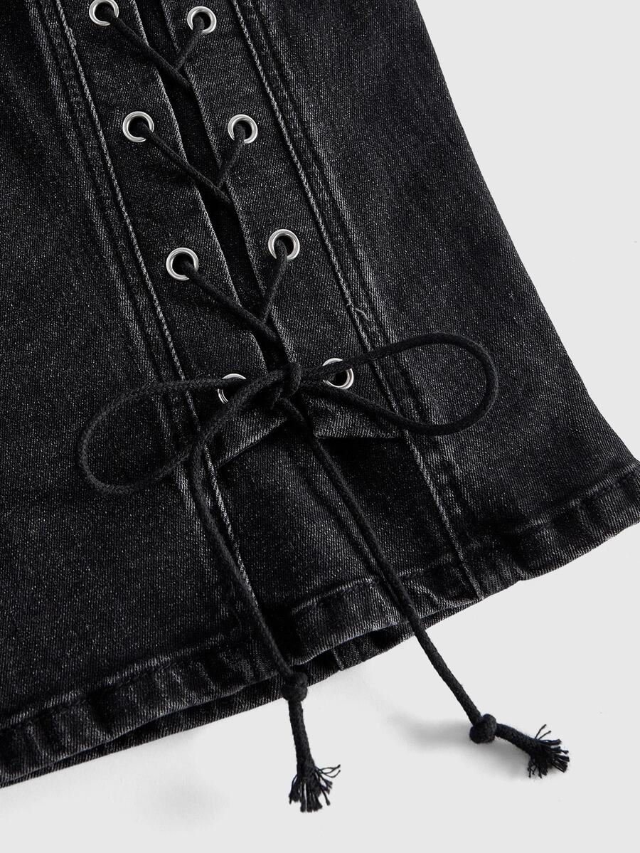 Women's plus size black denim Bermuda shorts with eyelet lace-up accents and mid-rise skinny fit